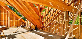 Home construction showing roof rafters.